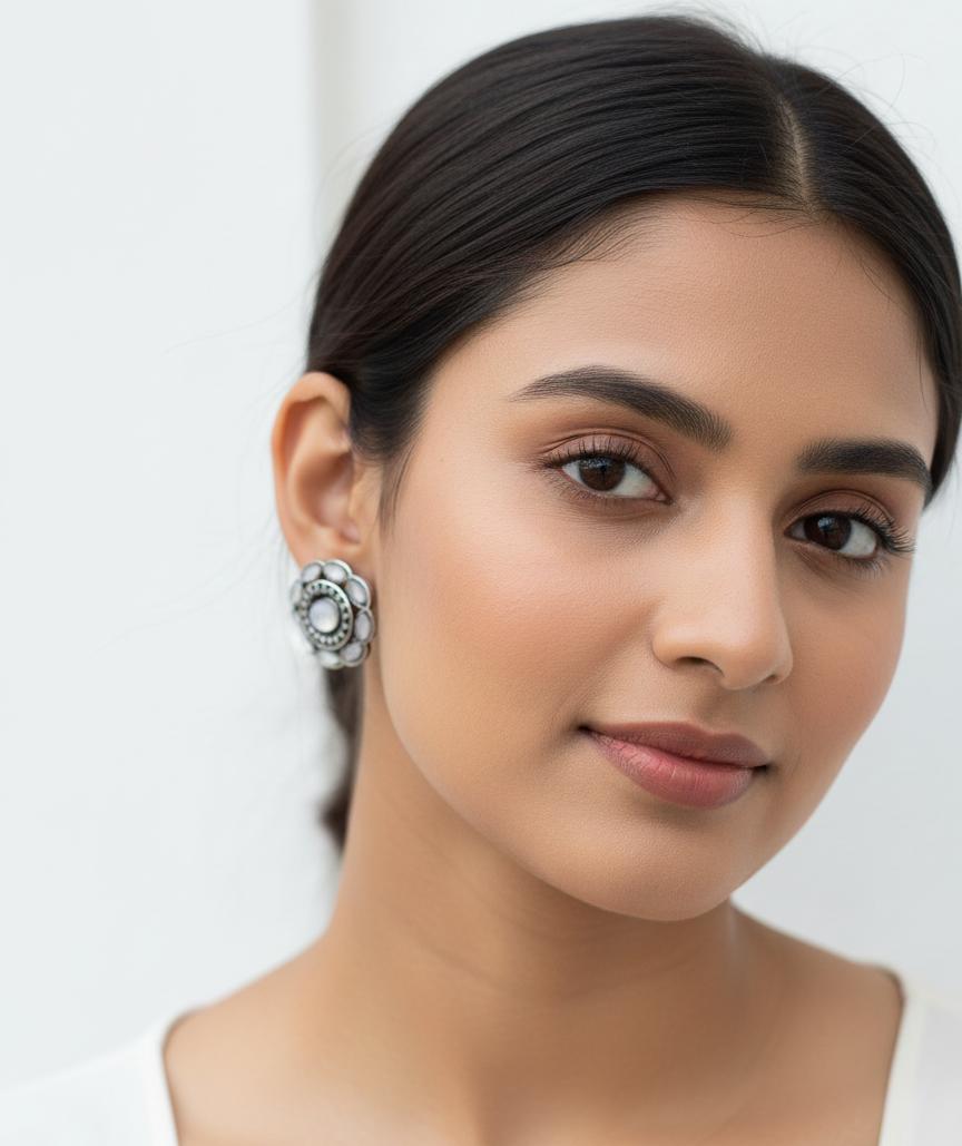 "Antique Silver-Plated Floral Stud Earrings with White Stone Accents"