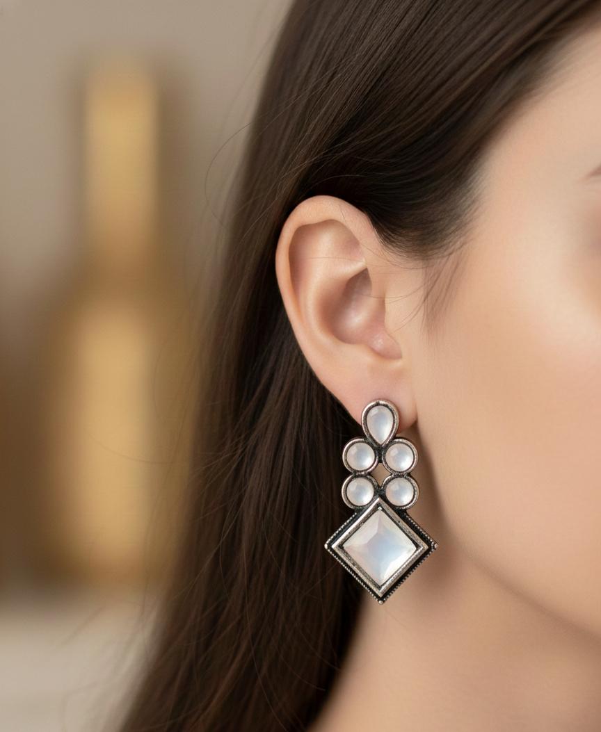 "Elegant Crystal Drop Earrings with Geometric and Pearly Accents"