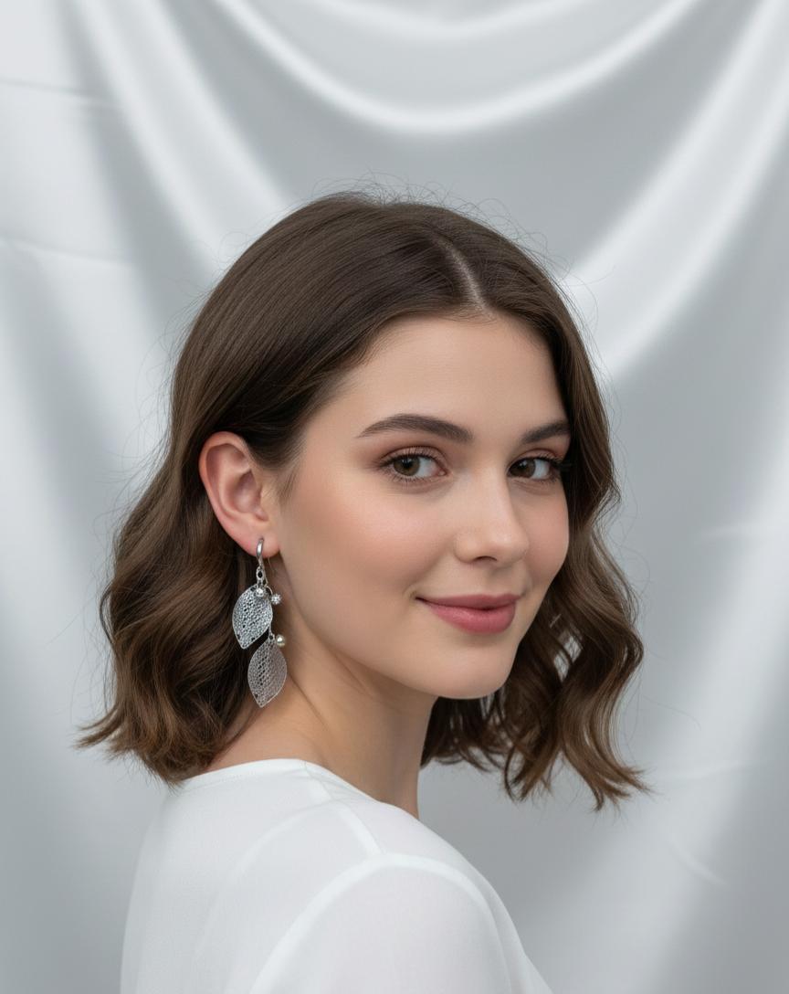 "Elegant Silver Leaf Dangle Earrings with Textured Design"